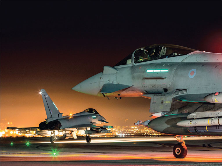 two raf typhoon fgr4 aircraft prepare to take off from raf akrotiri in cyprus to fly a sortie in support