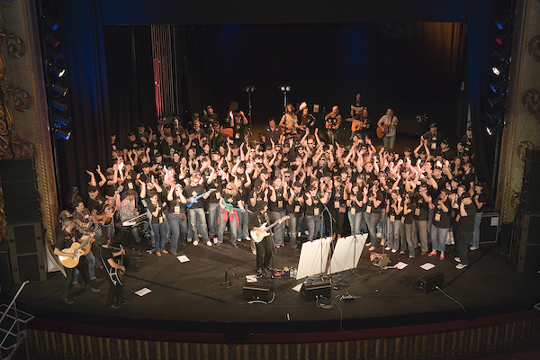 Music-based team building: A group of 200 performing the original song they’ve just written together.